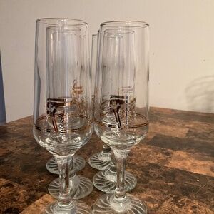 6 …1988 Vintage  Calgary Winter Olympics flute glasses with a 22k gold-accent